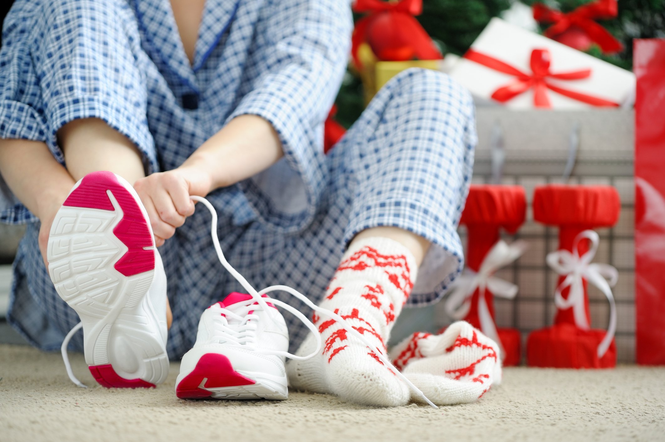 Holidays-Woman lacing up athletic shoes.jpg